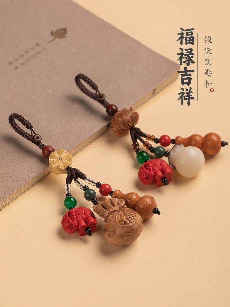 Mahogany gourd key buckle, steam piece cinnabar elephant Bodhi blessing bag key buckle can be used for fine packaging.